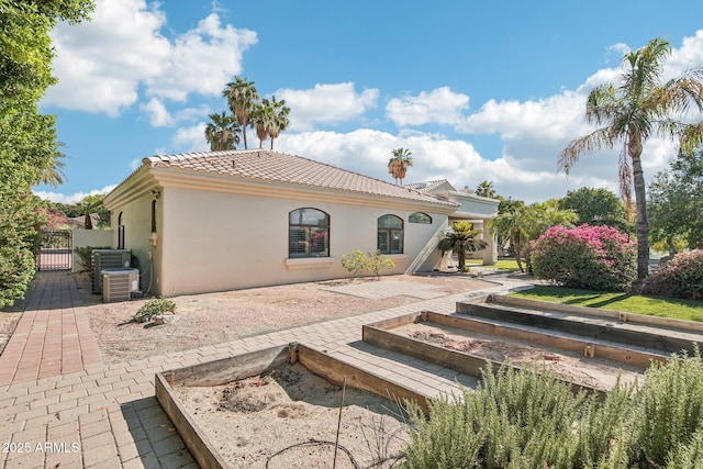 1330 N 40th St Unit 1, Mesa, AZ 85205 - back of property with a tile roof, stucco siding, a gate, and a patio