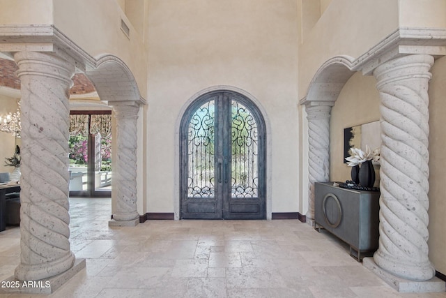 1330 N 40th St Unit 1, Mesa, AZ 85205 - entryway with decorative columns, french doors, arched walkways, stone tile floors, and a towering ceiling