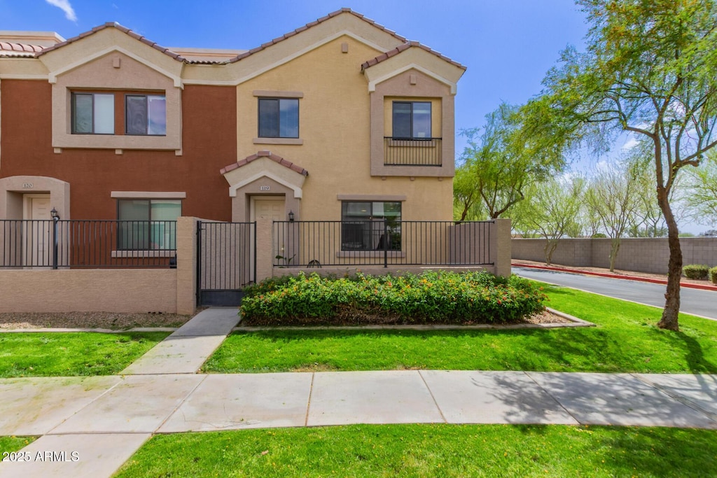 5225 E Enid Ave Unit 119, Mesa, AZ 85206 - view of property featuring a fenced front yard and stucco siding