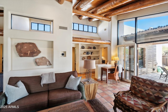 tiled living room with a towering ceiling, wood ceiling, visible vents, and beamed ceiling