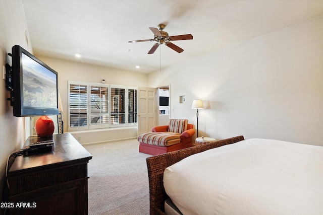 carpeted bedroom with a ceiling fan and recessed lighting