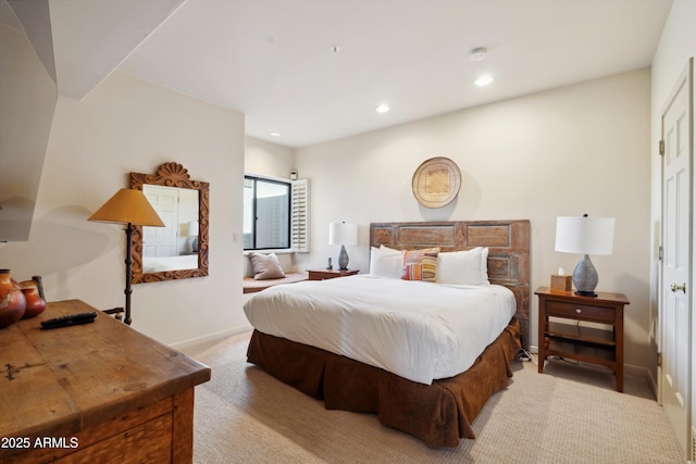 bedroom featuring recessed lighting, light colored carpet, and baseboards