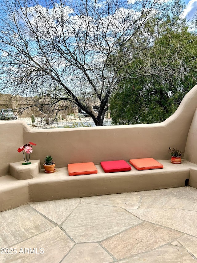 view of patio featuring a balcony