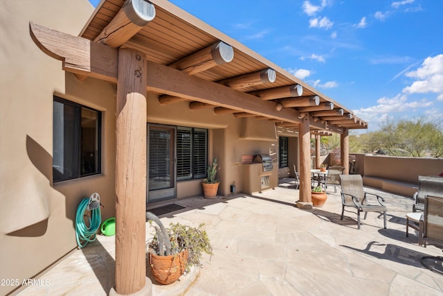 view of patio featuring outdoor dining area