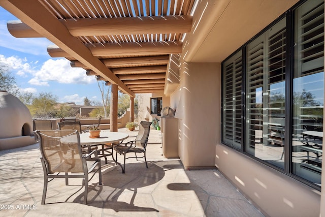 view of patio / terrace featuring outdoor dining space and fence