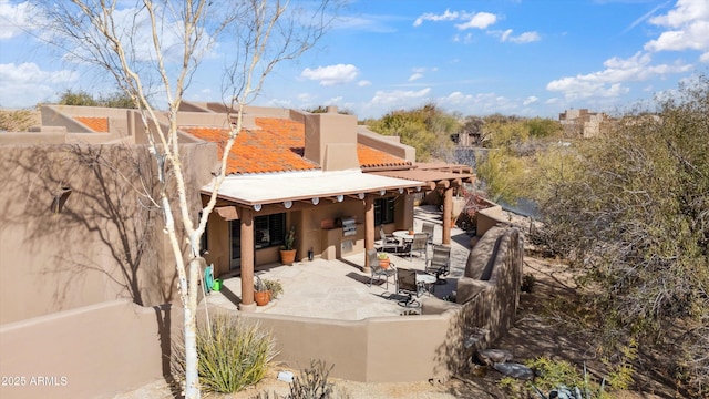 rear view of house featuring a patio