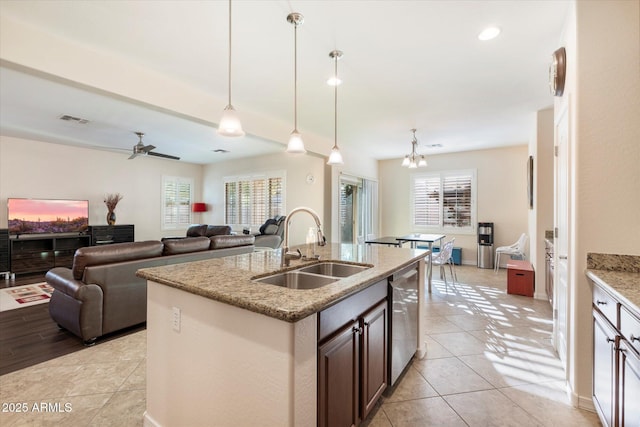 4032 S Santa Rita Pl, Chandler, AZ 85249 - kitchen with a sink, stainless steel dishwasher, healthy amount of natural light, light stone counters, and recessed lighting