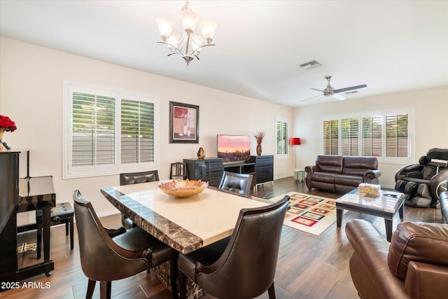 4032 S Santa Rita Pl, Chandler, AZ 85249 - dining area with a chandelier, dark wood-style flooring, and a ceiling fan