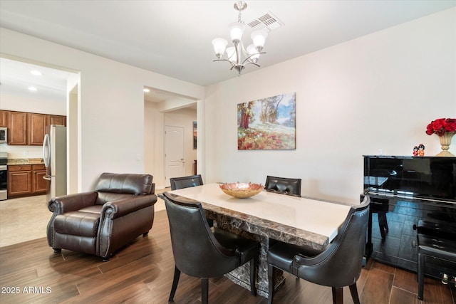 4032 S Santa Rita Pl, Chandler, AZ 85249 - dining space with wood finished floors, a chandelier, and recessed lighting