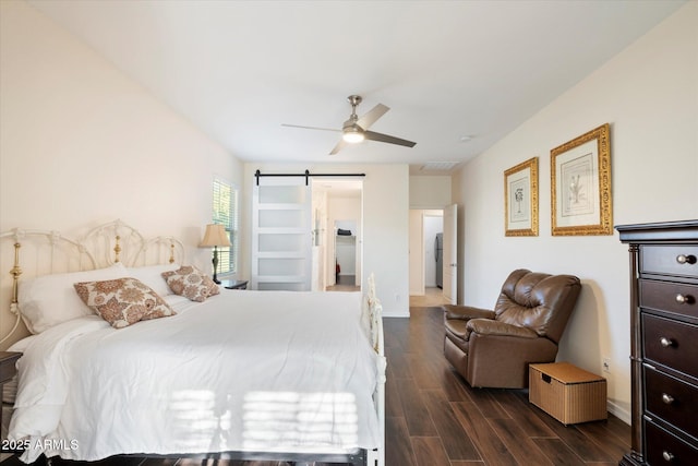 4032 S Santa Rita Pl, Chandler, AZ 85249 - bedroom with dark wood finished floors, a barn door, baseboards, and a ceiling fan
