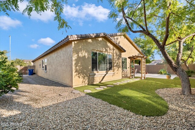 4032 S Santa Rita Pl, Chandler, AZ 85249 - view of home's exterior featuring stucco siding, a pergola, and a patio area