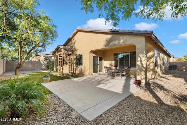 4032 S Santa Rita Pl, Chandler, AZ 85249 - rear view of house featuring stucco siding, central air condition unit, a fenced backyard, and a patio