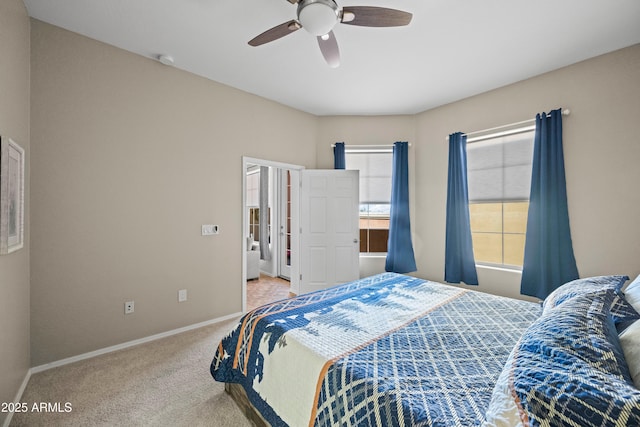 bedroom with carpet, baseboards, and ceiling fan