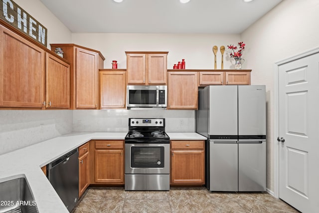 kitchen featuring light countertops and stainless steel appliances