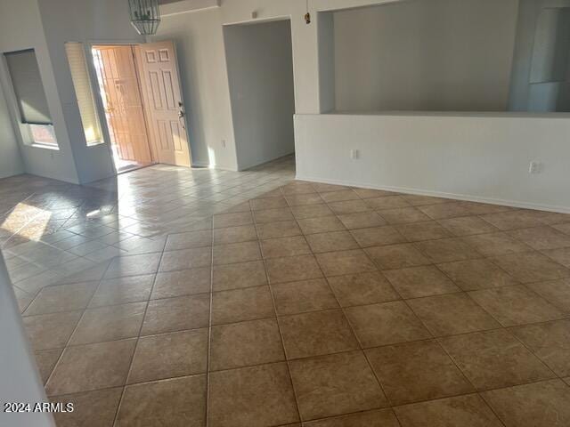 empty room with light tile patterned floors