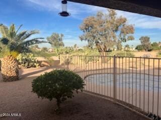 view of gate with fence