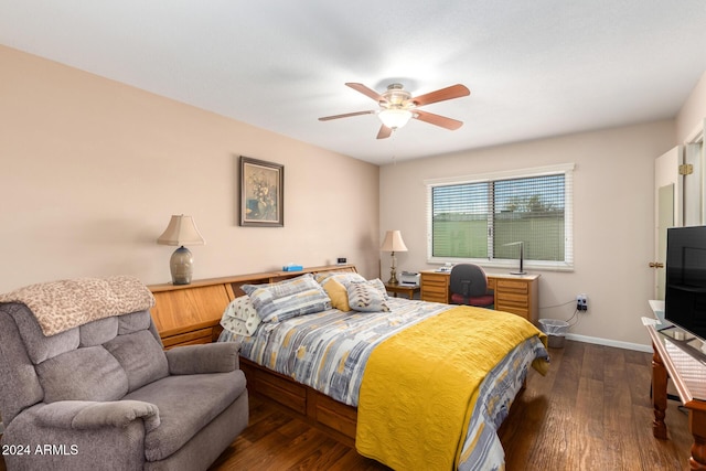 bedroom with ceiling fan and dark hardwood / wood-style floors