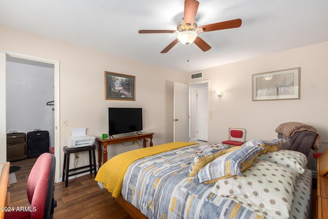 bedroom featuring dark hardwood / wood-style flooring and ceiling fan