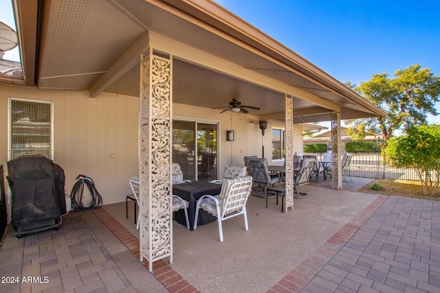 view of patio with area for grilling and ceiling fan