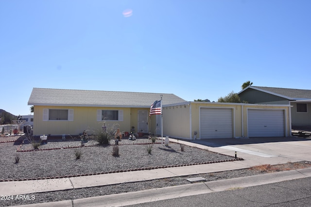 single story home featuring a garage