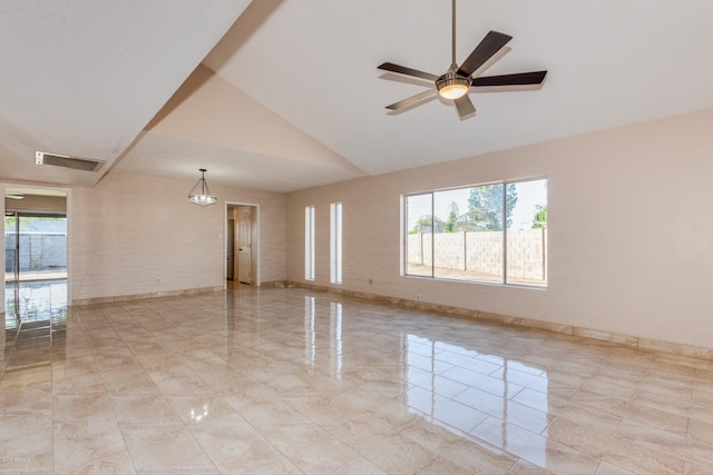 spare room with a ceiling fan, visible vents, high vaulted ceiling, and baseboards