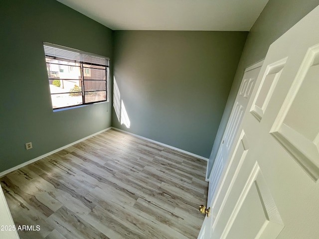 spare room featuring light wood-type flooring