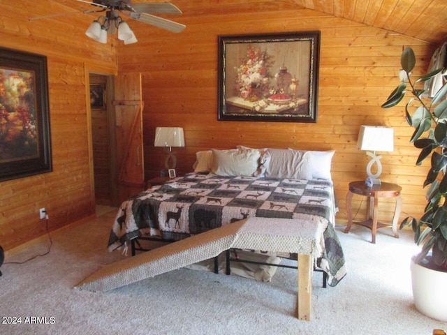 carpeted bedroom with lofted ceiling, wood walls, and wooden ceiling