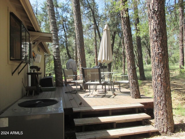 wooden deck featuring outdoor dining space