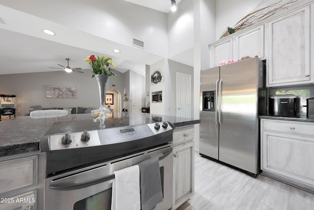 11446 N 109th St, Scottsdale, AZ 85259 - kitchen featuring stainless steel appliances, a ceiling fan, white cabinetry, open floor plan, and recessed lighting