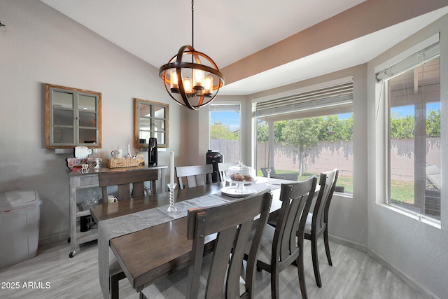 11446 N 109th St, Scottsdale, AZ 85259 - dining room with plenty of natural light, light wood-style floors, a chandelier, and vaulted ceiling