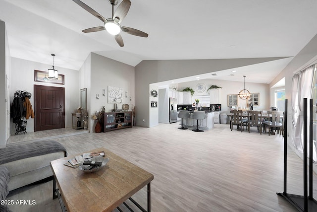 11446 N 109th St, Scottsdale, AZ 85259 - living area with vaulted ceiling, a ceiling fan, and light wood-style floors