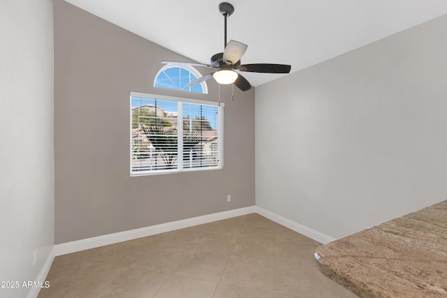 unfurnished room featuring lofted ceiling, light tile patterned floors, and ceiling fan