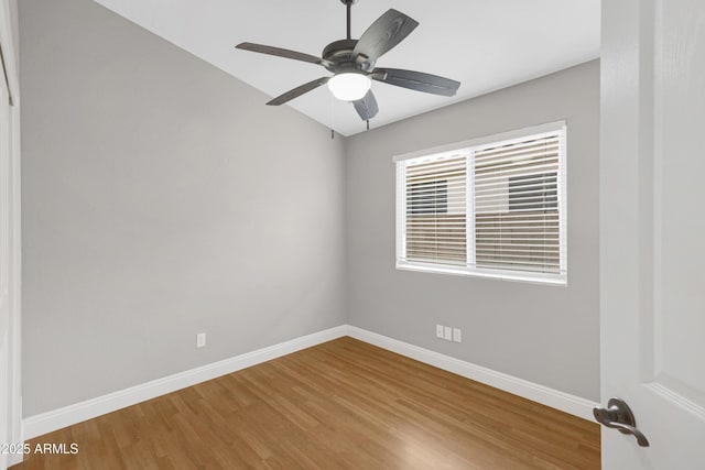 unfurnished room with hardwood / wood-style flooring and ceiling fan