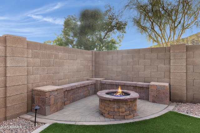 view of patio / terrace with an outdoor fire pit