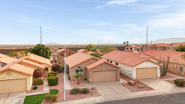 mediterranean / spanish-style house with a garage