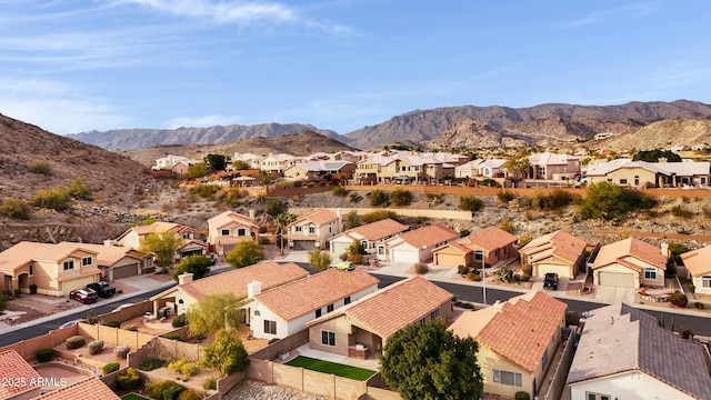 birds eye view of property with a mountain view