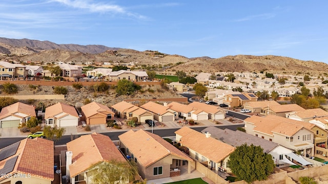 birds eye view of property with a mountain view