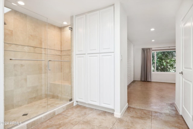 bathroom featuring tile patterned floors and walk in shower