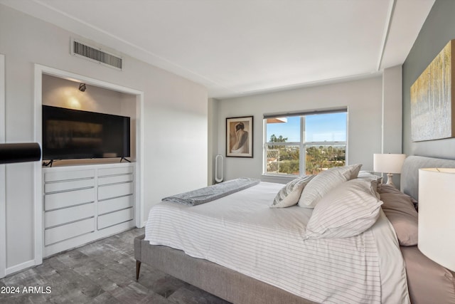 bedroom featuring wood-type flooring