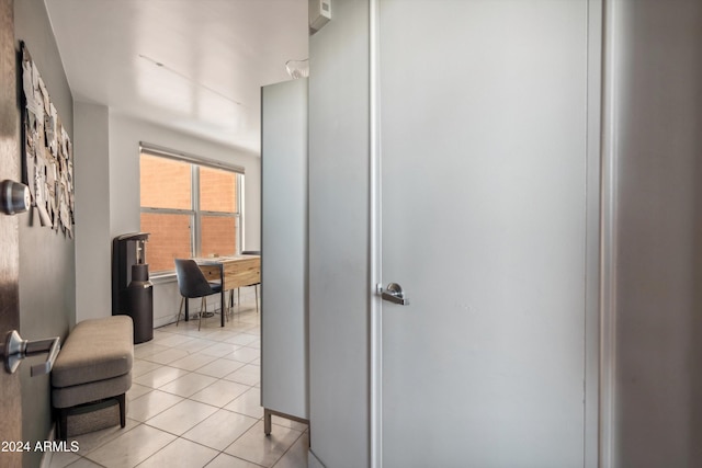 hallway with light tile patterned floors