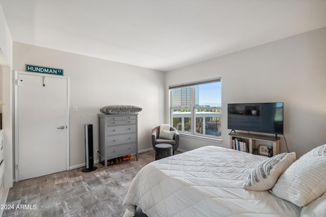 bedroom with light hardwood / wood-style floors