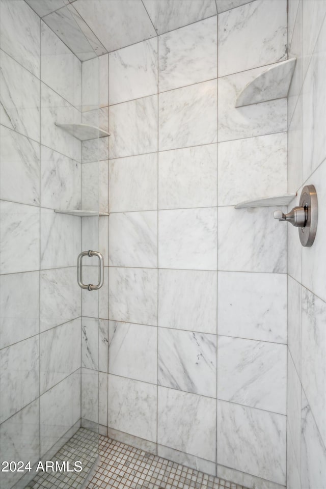 bathroom with a shower with shower door