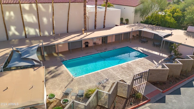 view of swimming pool with a patio area