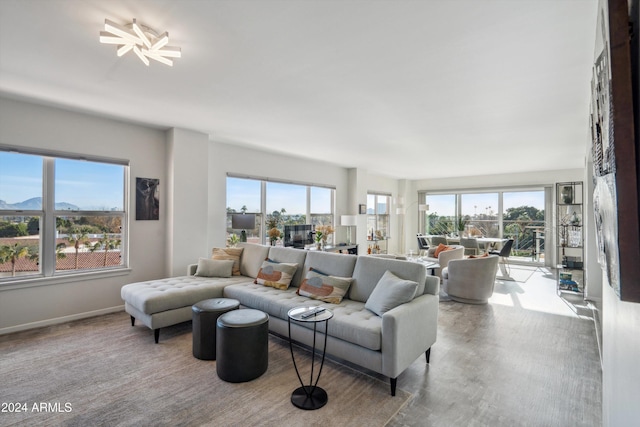 living room featuring a mountain view and plenty of natural light