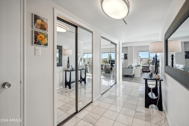 corridor featuring light tile patterned flooring