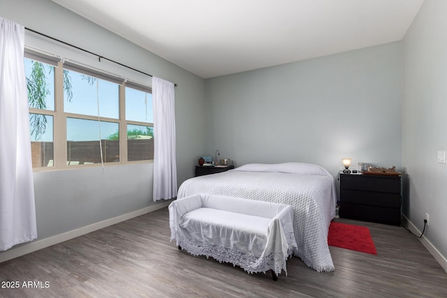 18474 W College Dr, Goodyear, AZ 85395 - bedroom featuring wood finished floors and baseboards