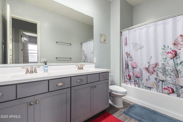 18474 W College Dr, Goodyear, AZ 85395 - bathroom with double vanity, wood finished floors, and shower / tub combo
