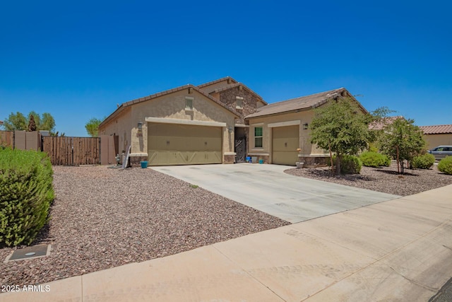 18474 W College Dr, Goodyear, AZ 85395 - ranch-style home featuring an attached garage, stucco siding, a gate, driveway, and a tile roof