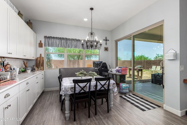 18474 W College Dr, Goodyear, AZ 85395 - dining area with wood finished floors, a chandelier, and recessed lighting