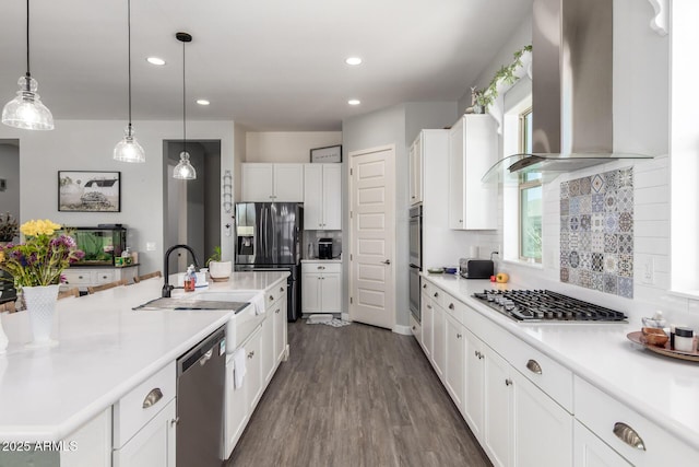 18474 W College Dr, Goodyear, AZ 85395 - kitchen with wall chimney range hood, stainless steel appliances, white cabinetry, tasteful backsplash, and recessed lighting